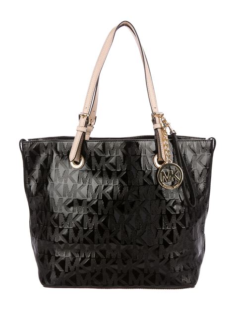 are michael kors bags real leather|michael kors patent leather bag.